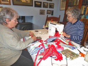 A photo of Maggie and Clare at the sewing machine